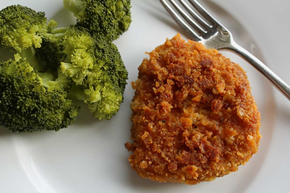 pork chop with broccoli on plate