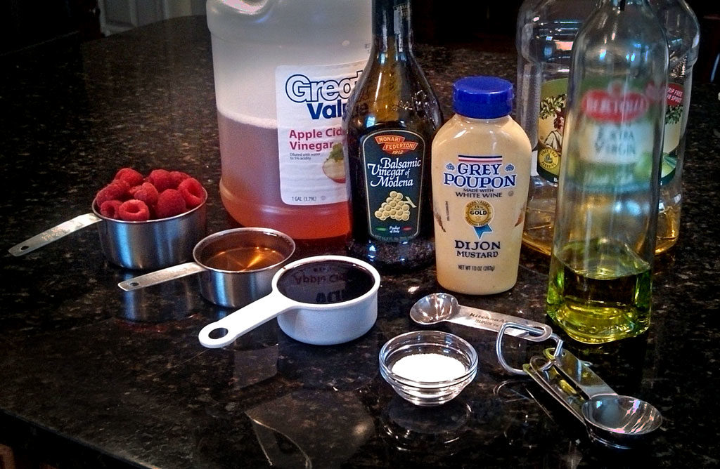 This tangy and sweet raspberry vinaigrette is easy to make and can be enjoyed all year round by using fresh or frozen raspberries. | TheMountainKitchen.com