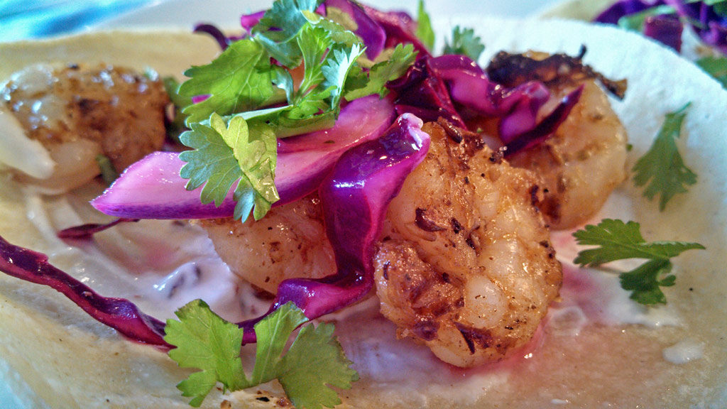 Smackin' Good Shrimp Tacos With Zesty Lime Slaw is made of shrimp marinated in garlicky oil flavored with Mexican spices, topped with a zesty lime slaw. | TheMountainKitchen.com