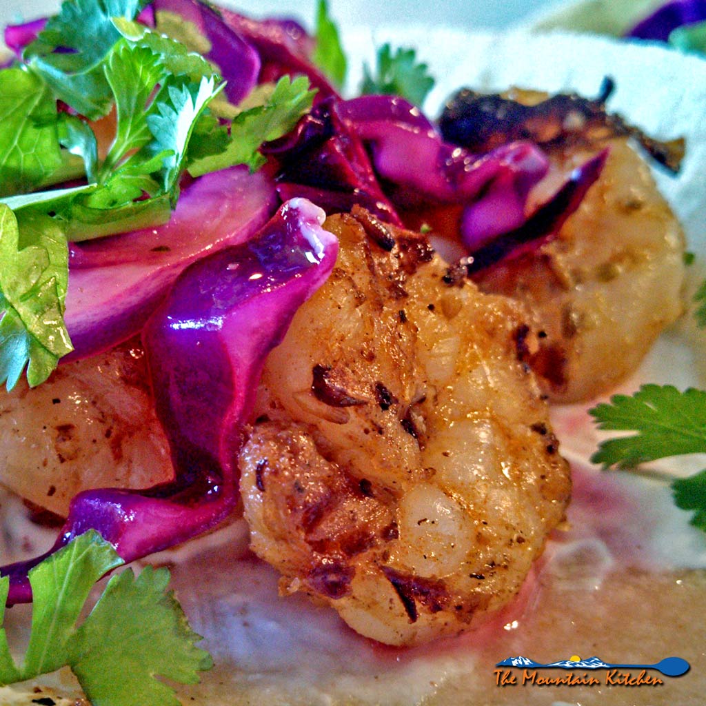 Smackin' Good Shrimp Tacos With Zesty Lime Slaw is made of shrimp marinated in garlicky oil flavored with Mexican spices, topped with a zesty lime slaw. | TheMountainKitchen.com