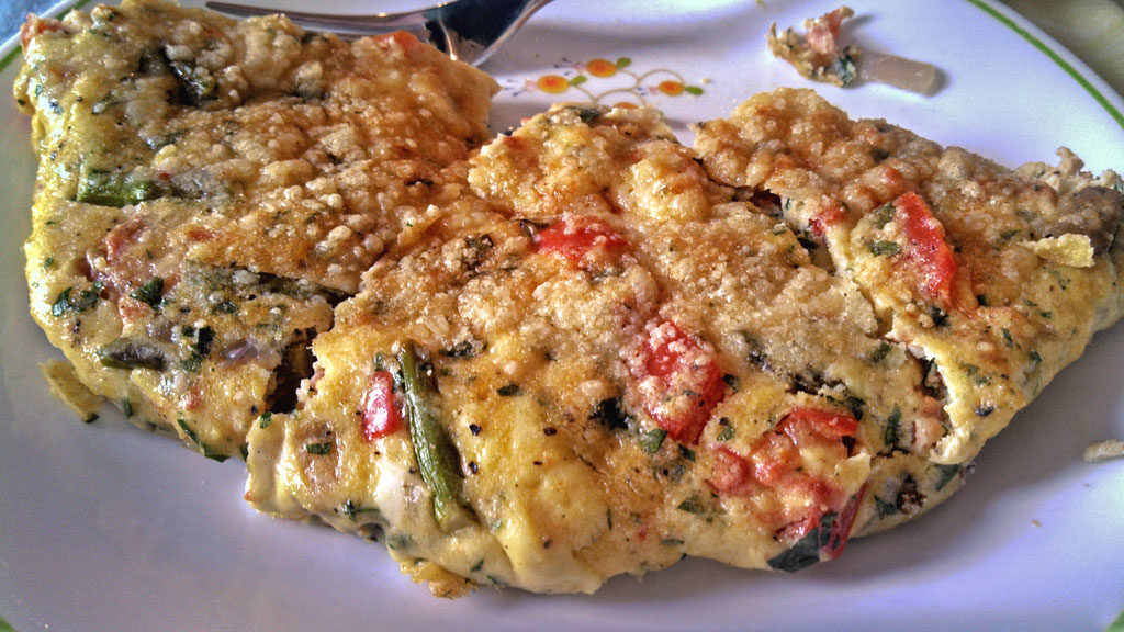Have breakfast for supper with this vegetable herb frittata is made with fresh asparagus, red bell peppers, mushrooms and onions. A tasty meal any time! | TheMountainKitchen.com