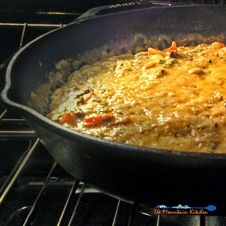 Have breakfast for supper with this vegetable herb frittata is made with fresh asparagus, red bell peppers, mushrooms and onions. A tasty meal any time! | TheMountainKitchen.com