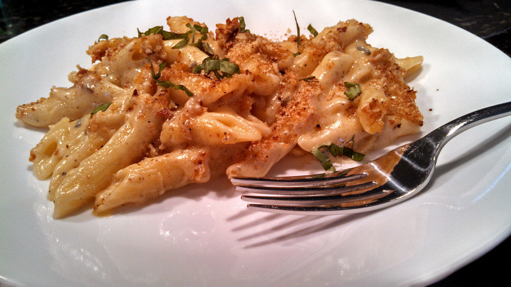 Adult macaroni and cheese on a plate ready to eat