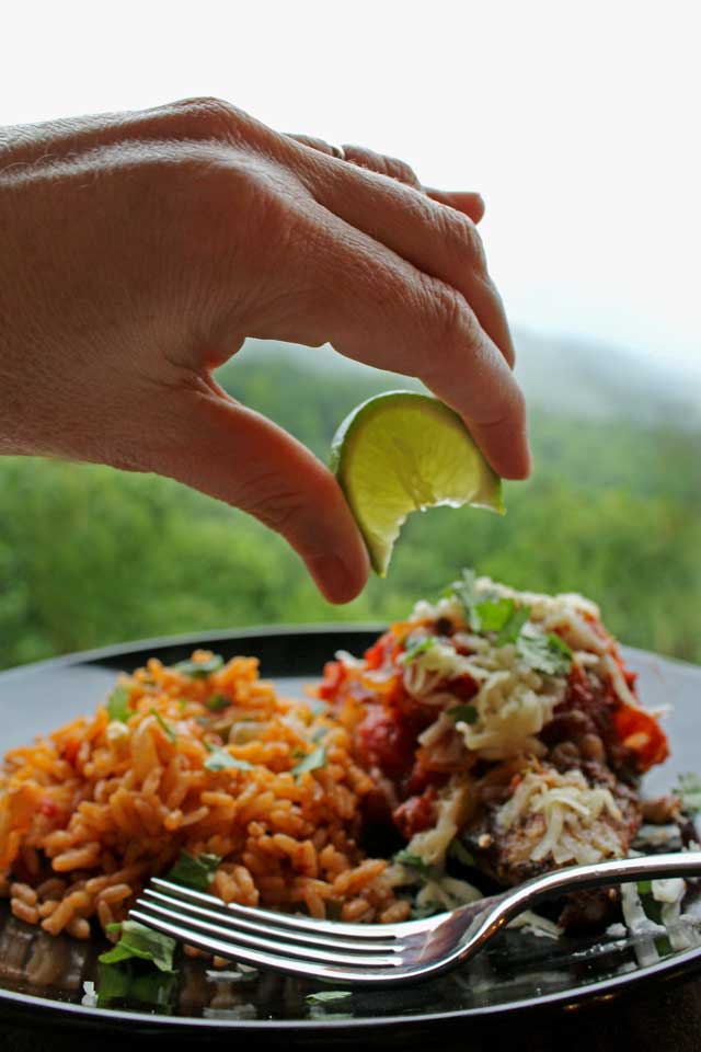 squeezing lime onto chicken