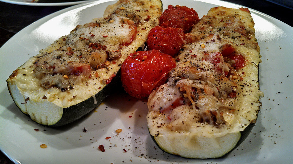 These Italian zucchini boats are filled with sauteed mushrooms, onions and honey roasted tomatoes and cheese. A quick and easy low-carb meal! | TheMountainKitchen.com