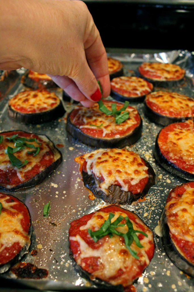 Julia Child's eggplant pizzas are low-carb and gluten-free, made using eggplant slices in place of traditional pizza crust. The eggplant slices are topped with warm tomato sauce, piled high with cheese and so good you'll totally forget about pizza crust. | TheMountainKitchen.com
