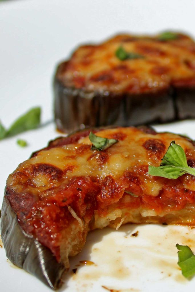 Julia Child's eggplant pizzas are low-carb and gluten-free, made using eggplant slices in place of traditional pizza crust. The eggplant slices are topped with warm tomato sauce, piled high with cheese and so good you'll totally forget about pizza crust. | TheMountainKitchen.com