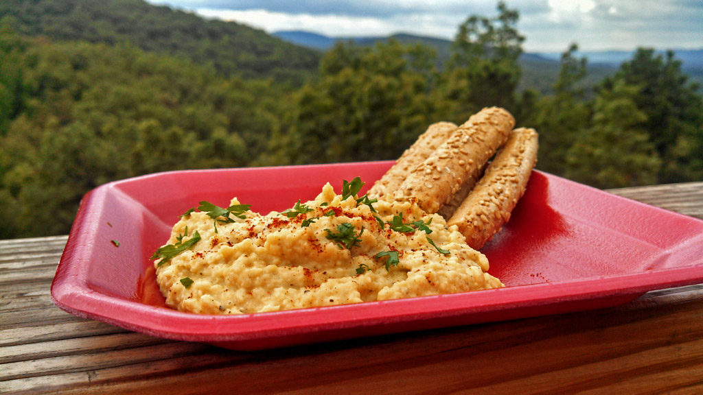 The fall weather promotes good picnicking weather. Try making this hummus dip flavored with sesame oil, garlic and cumin. It's Tahini Free! | TheMountainKitchen.com