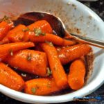 Balsamic Honey Glazed Carrots: Baby carrots glazed in a balsamic honey sauce of butter, honey, balsamic vinegar, salt and pepper. A tasty side dish! | TheMountainKitchen.com