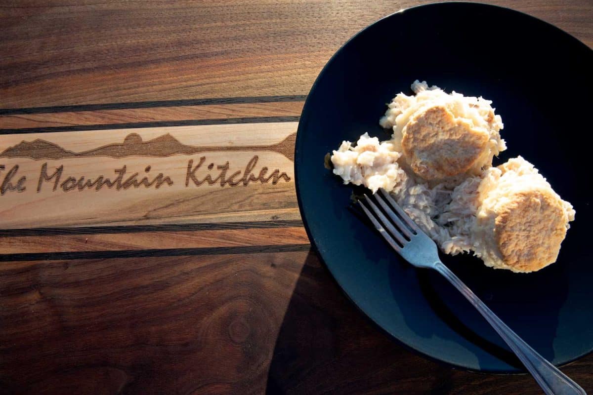 chicken and rice with biscuits on top on a plate