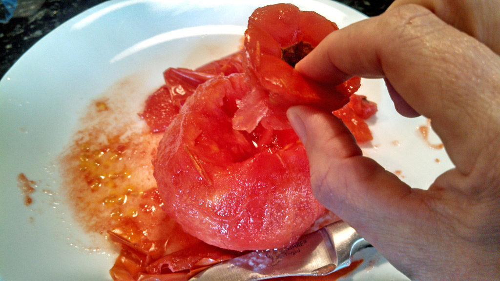 Easy to follow instructions on how to peel and core tomatoes. You can process 3-4 tomatoes at a time using the boiling water method. | TheMountainKitchen.com