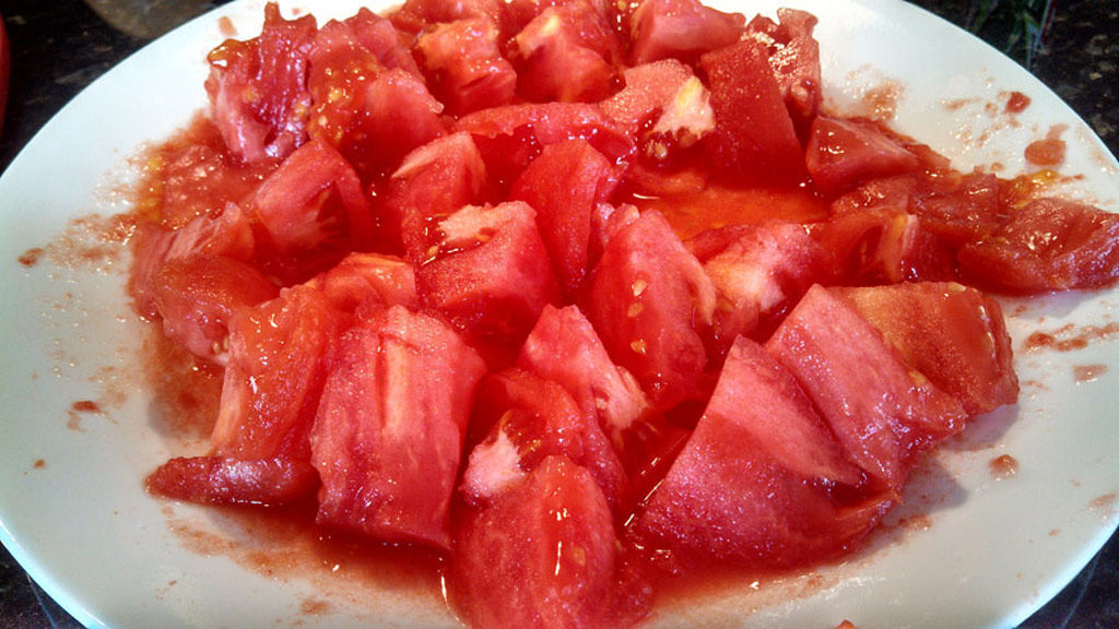 Easy to follow instructions on how to peel and core tomatoes. You can process 3-4 tomatoes at a time using the boiling water method. | TheMountainKitchen.com