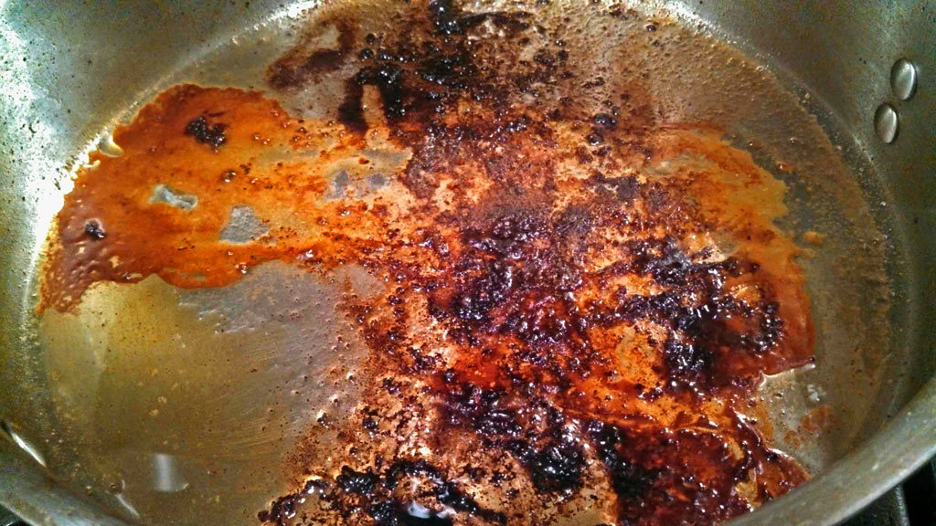 pan with browned bits in bottom