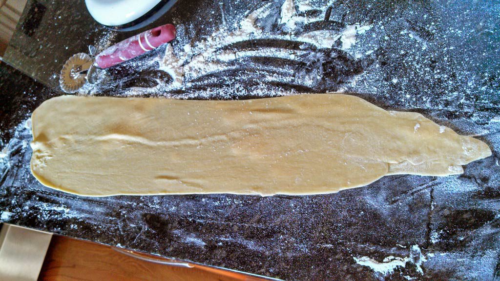 past dough rolled out on floured surface