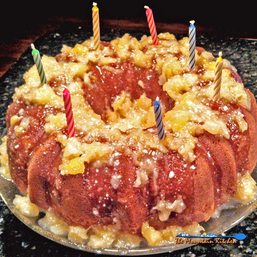 This fluffy, moist pineapple bundt cake, topped with a sweet pineapple glaze is the perfect cake to celebrate any occasion. | TheMountainKitchen.com