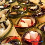 Ratatouille spirals are made of sliced eggplant, zucchini, roasted red peppers, creamy mozzarella cheese, and anchovies, rolled and baked in tomato sauce. | TheMountainKitchen.com