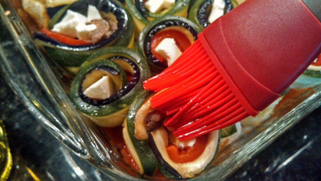 Ratatouille spirals are made of sliced eggplant, zucchini, roasted red peppers, creamy mozzarella cheese, and anchovies, rolled and baked in tomato sauce. | TheMountainKitchen.com