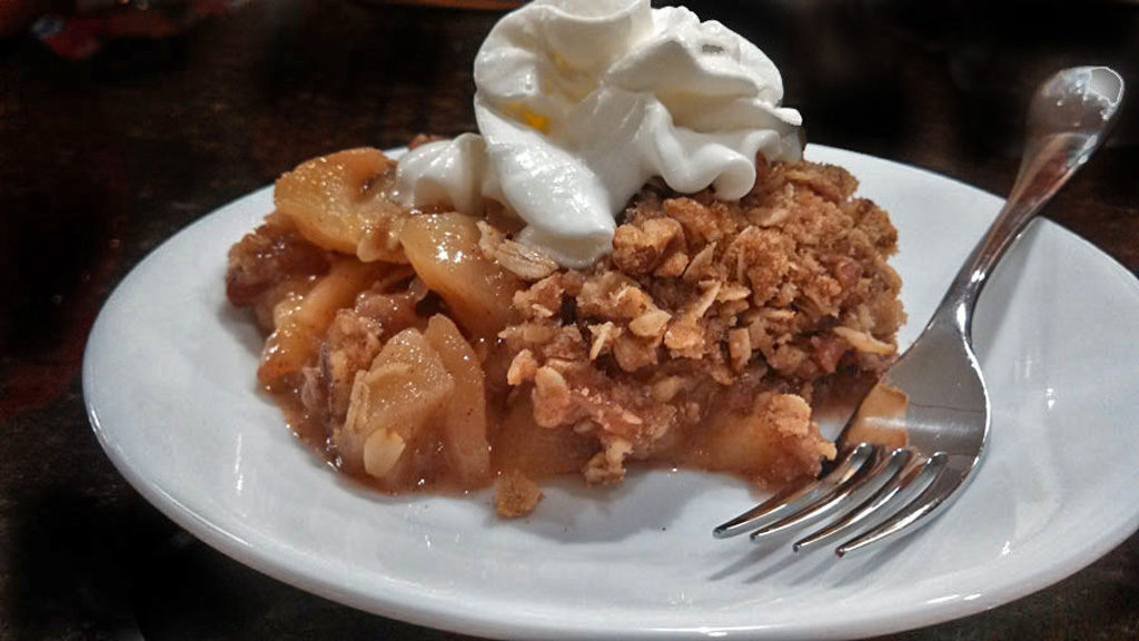 David's apple crisp uses fresh golden delicious apples and topped with rolled oats, sugar, cinnamon and pecans. A wonderful dessert for fall gatherings! | TheMountainKitchen.com