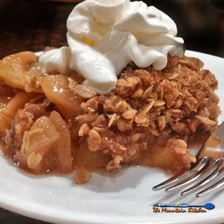 David's apple crisp uses fresh golden delicious apples and topped with rolled oats, sugar, cinnamon and pecans. A wonderful dessert for fall gatherings! | TheMountainKitchen.com