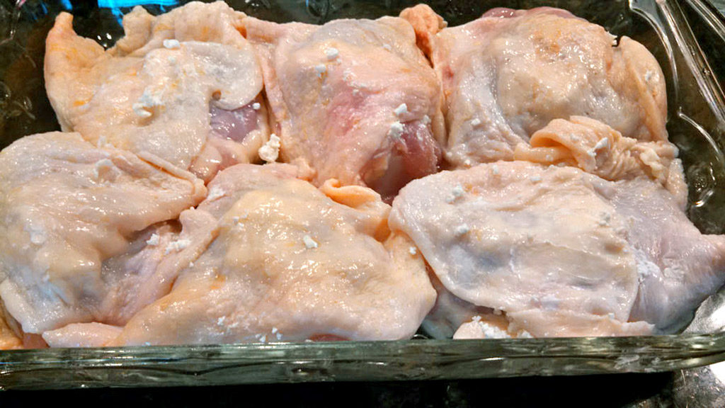 Taste the Mediterranean with these Greek-Style Chicken Thighs stuffed with tangy goat cheese and marinated in a bold and zesty Greek Dressing. | TheMountainKitchen.com