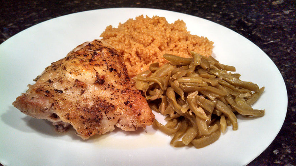 Taste the Mediterranean with these Greek-Style Chicken Thighs stuffed with tangy goat cheese and marinated in a bold and zesty Greek Dressing. | TheMountainKitchen.com