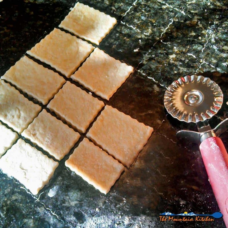 Fresh homemade saltine crackers simple to make, only take 30 minutes and require 4 ingredients and are so much better than store bought! Try this recipe! | TheMountainKitchen.com