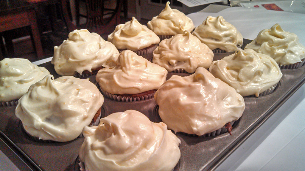 These molasses rich gingerbread cupcakes are infused with warm crystallized ginger, topped with a zesty and fresh orange cream cheese frosting. | TheMountainKitchen.com