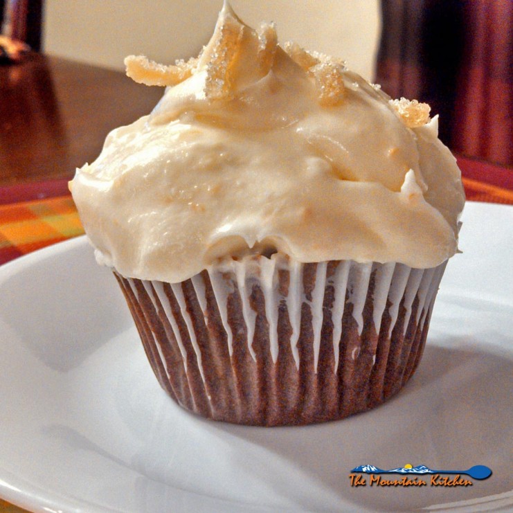 These molasses rich gingerbread cupcakes are infused with warm crystallized ginger, topped with a zesty and fresh orange cream cheese frosting. | TheMountainKitchen.com