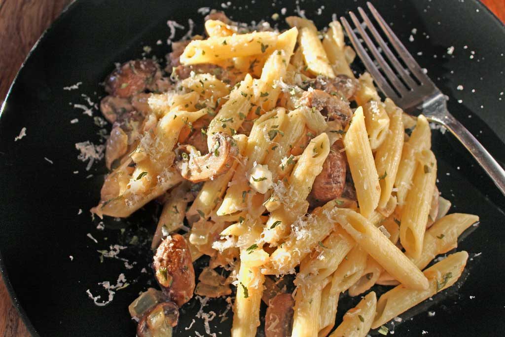 Penne pasta piled high on plate