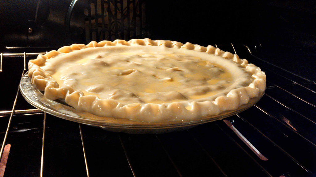 chicken pot pie baking in oven
