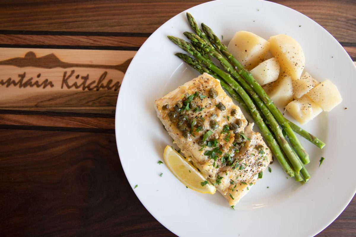 halibut on plate with asparagus and potatoes