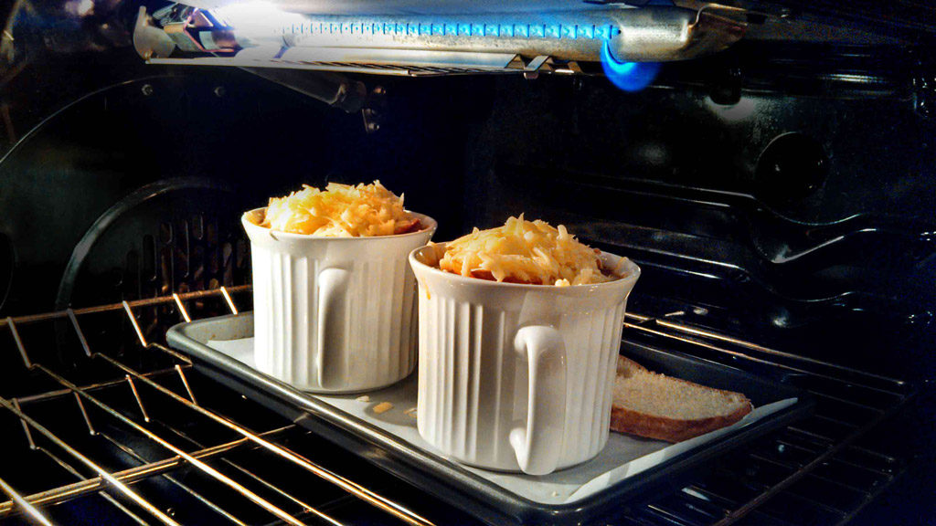 Healthy French Onion Soup under broiler in oven