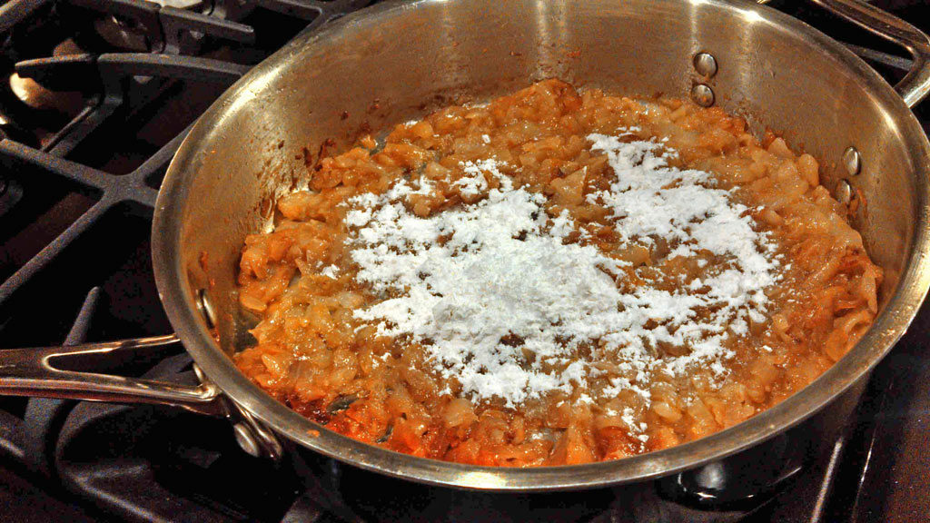 browned onions in pan with flour