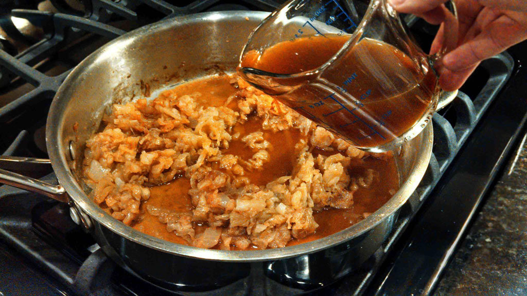 pouring broth into pan