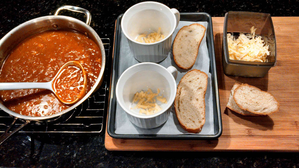 bowls with bread and cheese ready for soup