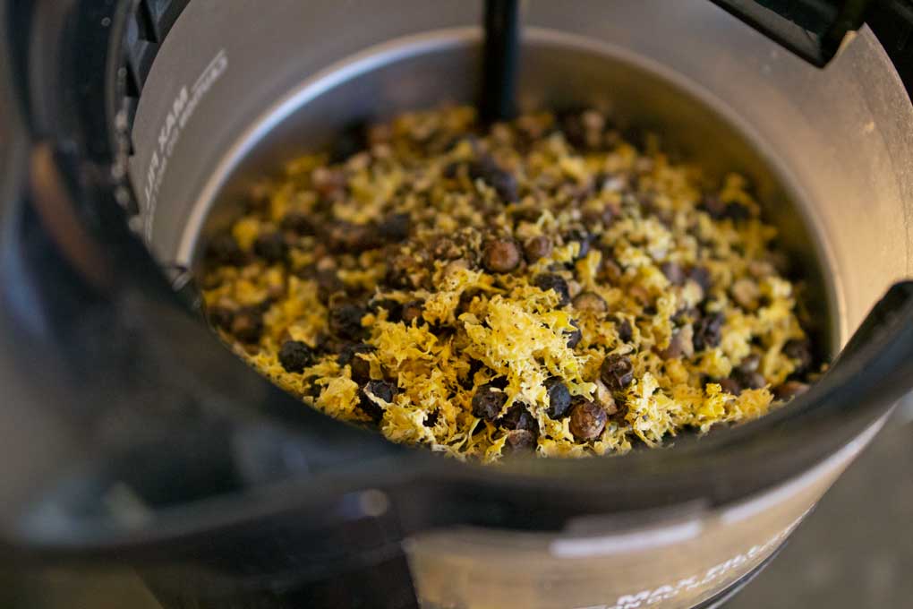 lemon zest and peppercorns in grinder