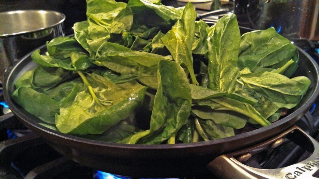 Tender sauteed spinach in butter and olive oil, with fresh mushrooms and green onions is a quick easy and nutritious side dish, ready in just minutes! | TheMountainKitchen.com