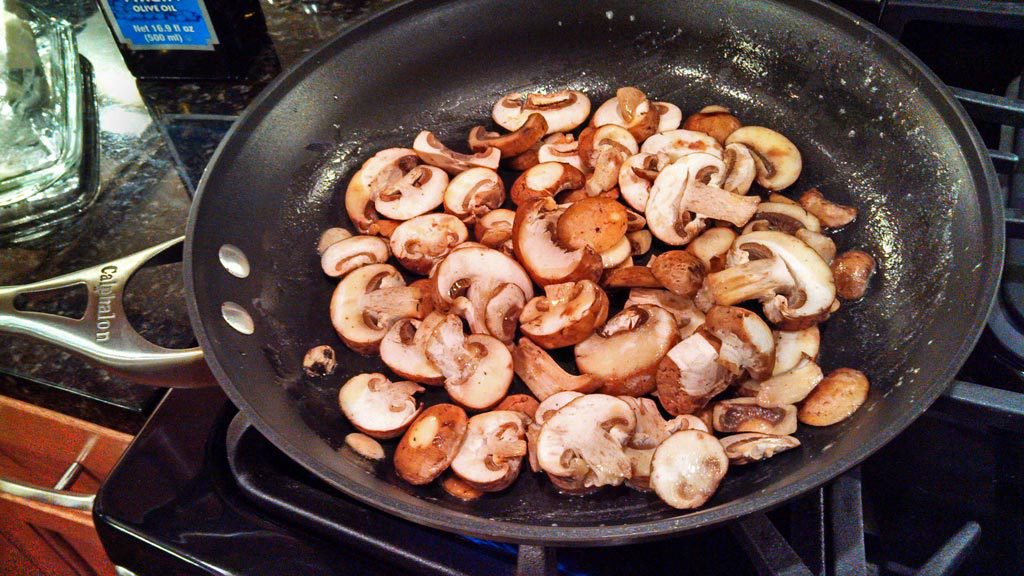 sliced mushrooms in skillet