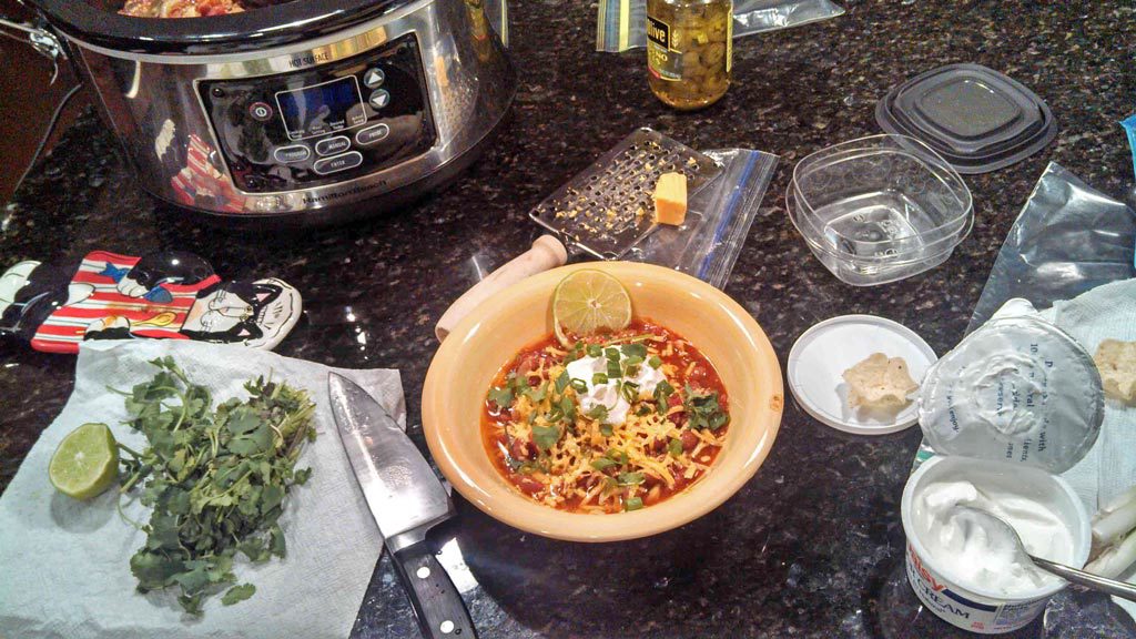 bowl of chili on messy counter