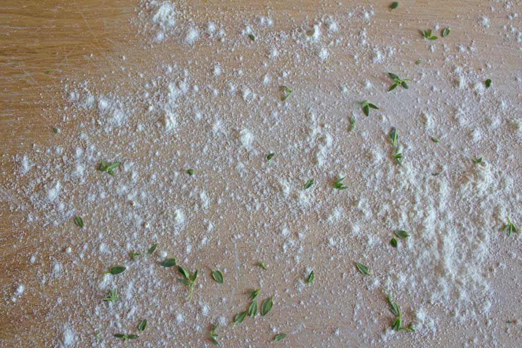flour and thyme on work surface