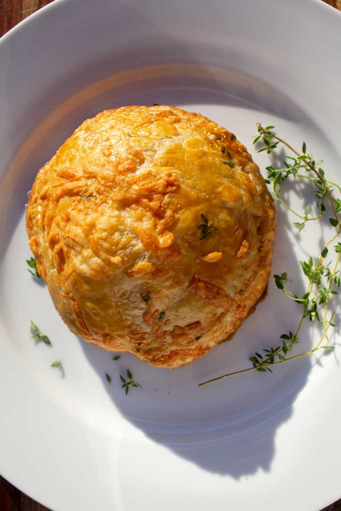 mushroom wellington on plate with fresh thyme