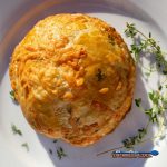 mushroom wellington on plate with fresh thyme
