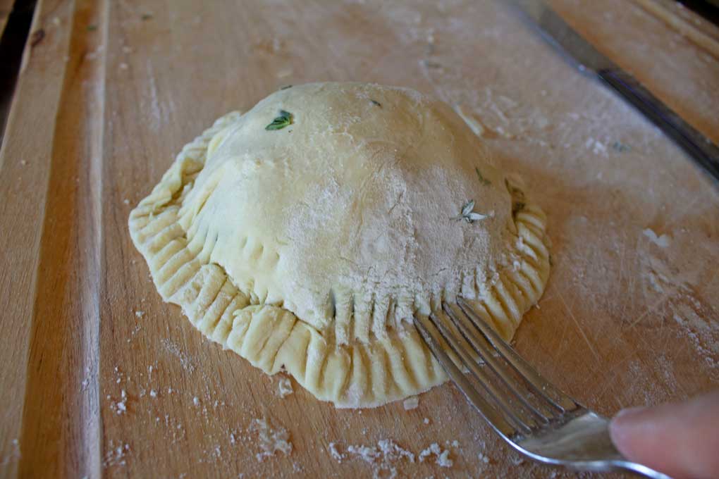 crimping pastry dough with fork