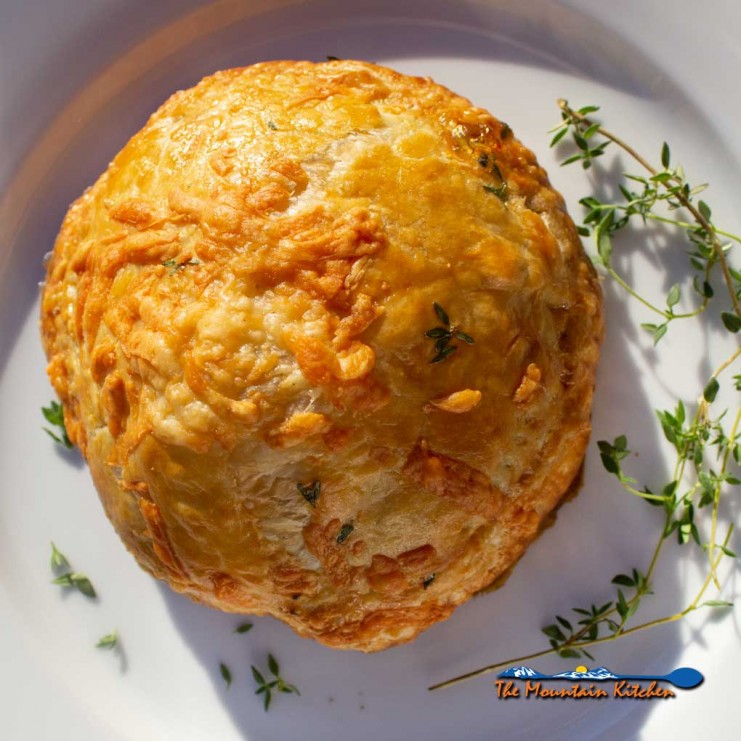 mushroom wellington on plate with fresh thyme