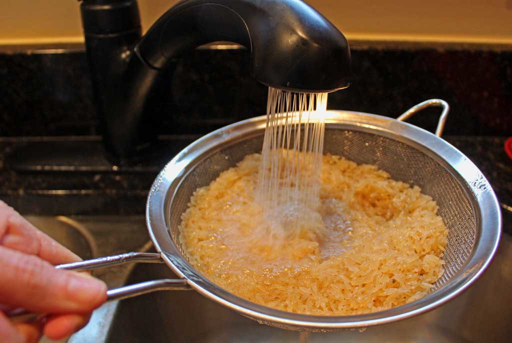rinsing rice in sink