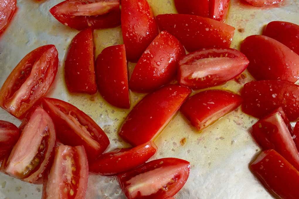 chopped tomatoes on sheet pan