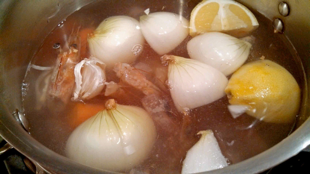 chopped vegetables and lemon in saucepan