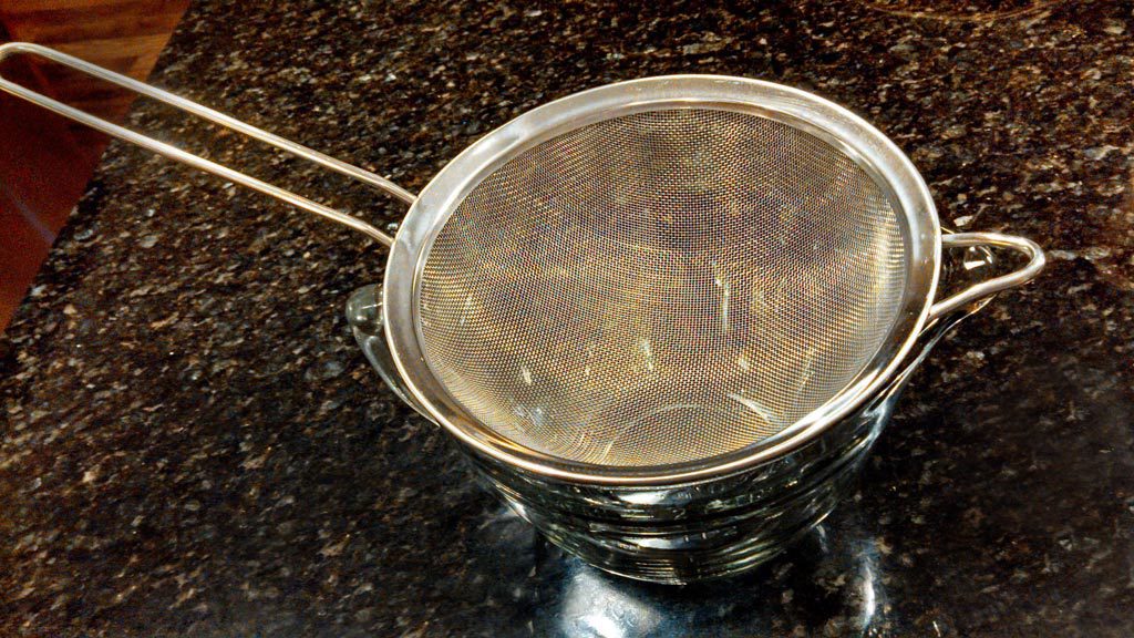 a sieve over a bowl
