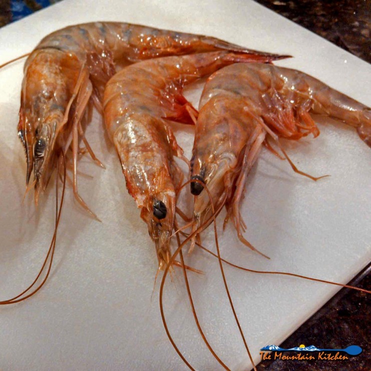 raw shrimp on cutting board