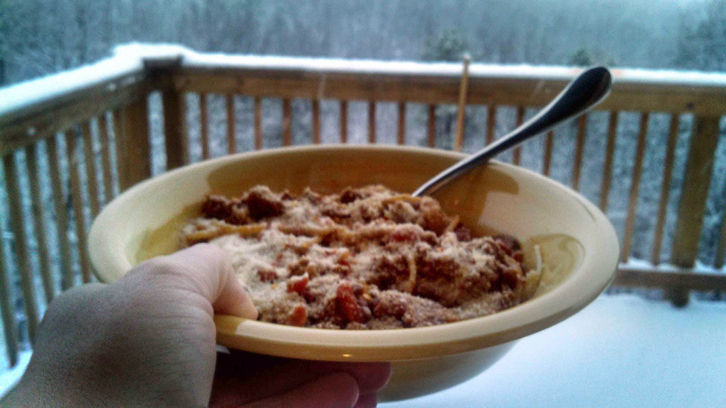This thick chunky bolognese is loaded with ground beef, tomatoes and onions. It only takes 1 hour, which means it makes a quick and easy weeknight meal! | TheMountainKitchen.com